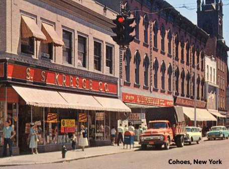Three dimestores side-by-side in Cohoes, New York in the late 1950s.  From left to right S. S. Kresge Co., M. H. Fishman Co. and (in the smallest of the three), the originators of the genre F. W. Woolworth Co.