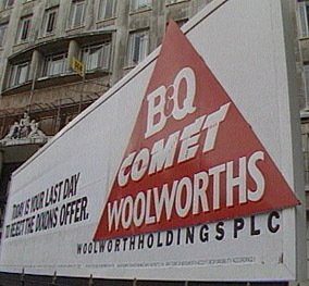 A hording on the forecourt at Marylebone canvases investors to reject the Dixons offer for Woolworths, April 1986