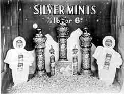 This F.W. Woolworth window display from the early 1930s informed shoppers of a special offer on weigh-out silver mints. Half a pound (227g) of the sweets were just sixpence on the store's pic'n'mix counter