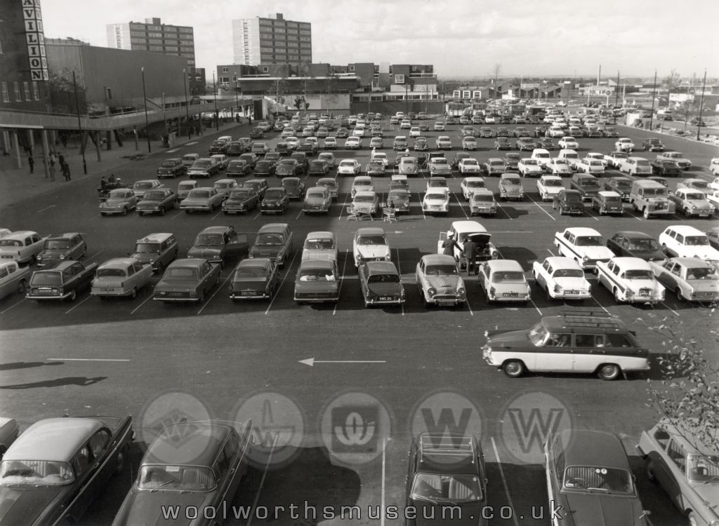 The Woolco store had a huge 300 space surface car park, with no time restrictions. Here It was packed with 60s cars, with lots of registration numbers ending in  'D' (1966), 'E' (1967), and 'F' (brand new), nearly all British-made, from the factories of BMC/British Leyland (later /Rover), Ford and Vauxhall.